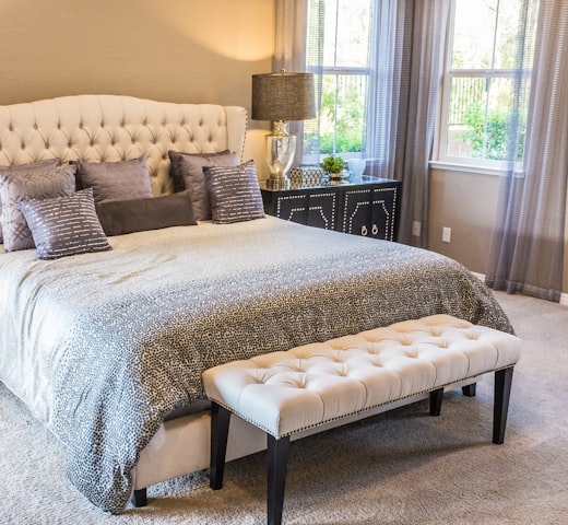 Bedroom with tufted bench